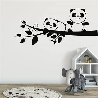 Väggdekor med gulliga pandor på en gren.