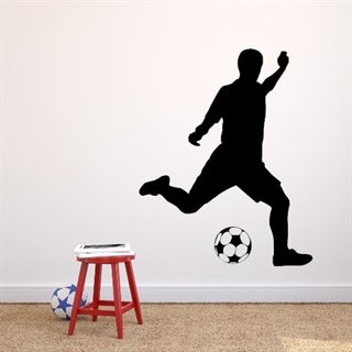 Väggdekor med fotbollsspelare som sparkar till en boll